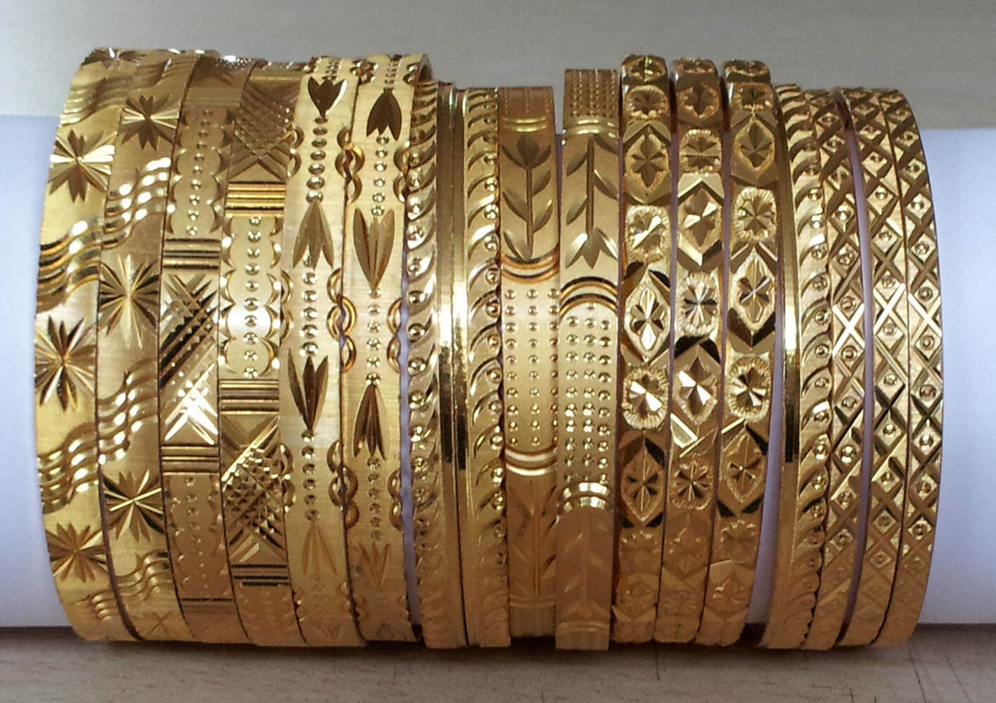 Gold bangles clearance cutting designs